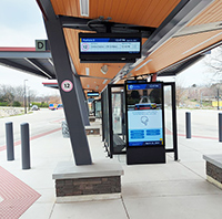 Photo of a bus bay and touchscreen kiosk at Central Station